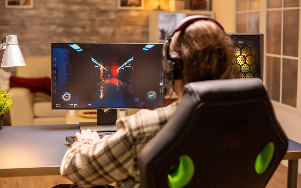 gamer at his monitor playing videogames
