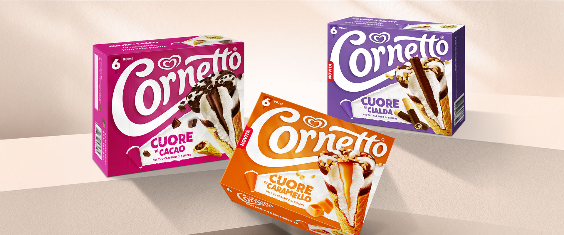 Cocoa Heart, Caramel Heart and Wafer Heart Croissant packs presented in a minimal photography set that enhances the new design